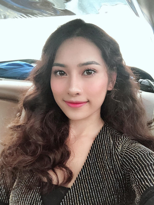 Cheerful Woman with Long Wavy Hair - Leah Collins